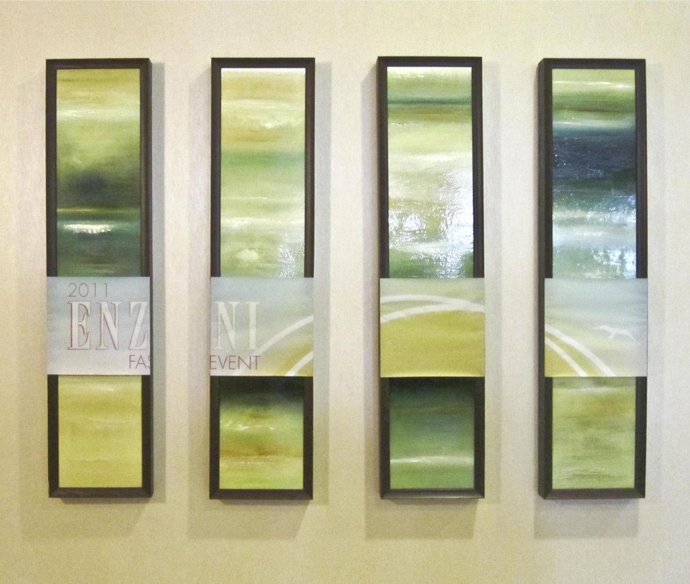 Four framed 2011 Enzoani Fashion Event art panels in green and gold
