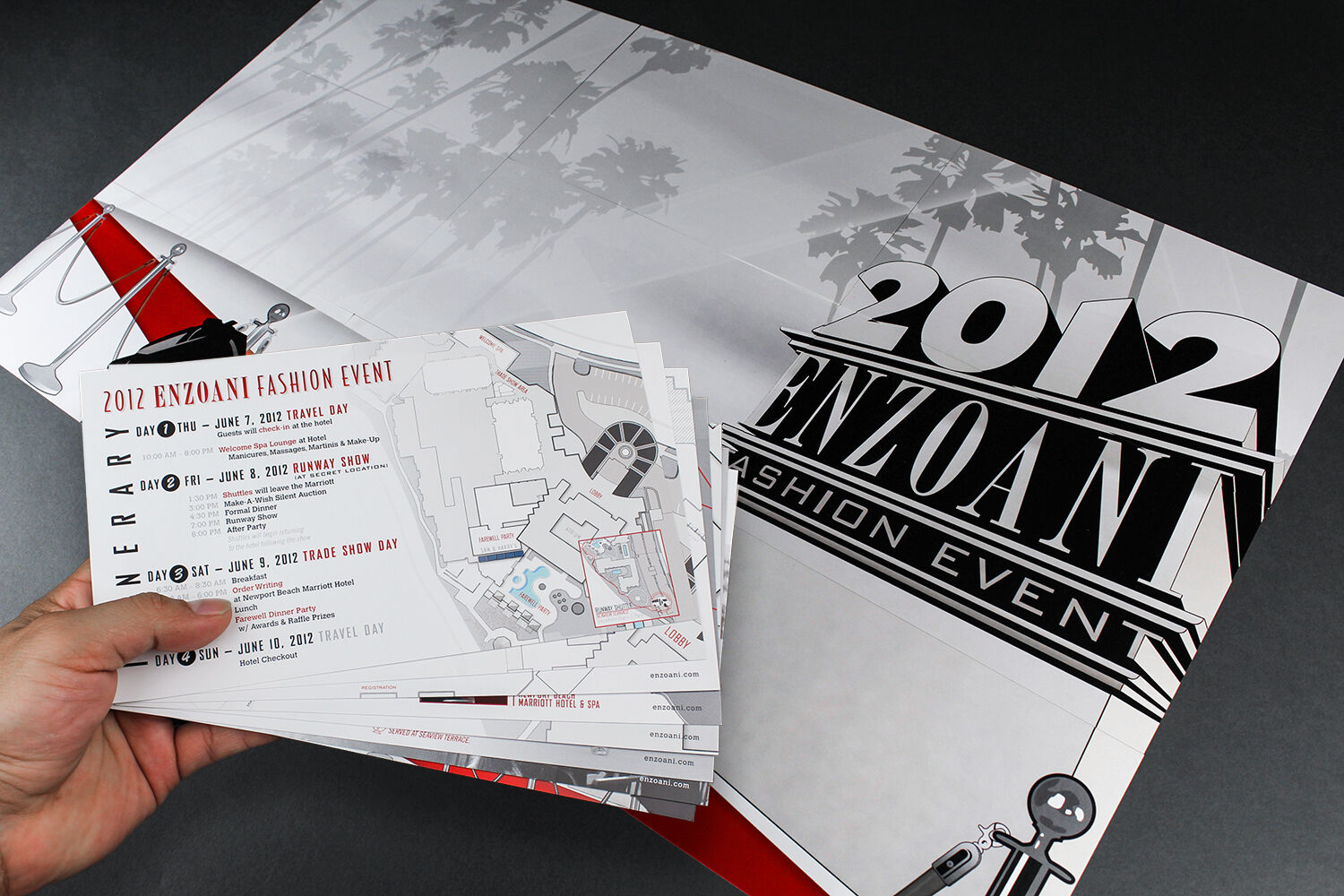 2012 Enzoani invitation in hand