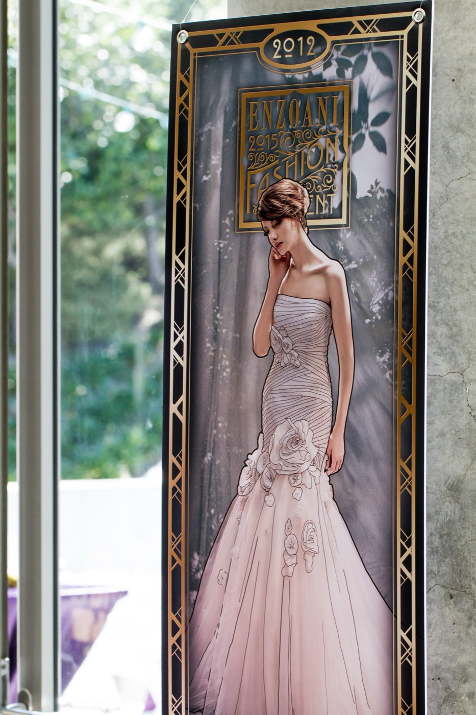 Art Nouveau framed anniversary banner featuring an Enzoani gown from the 2012 collection