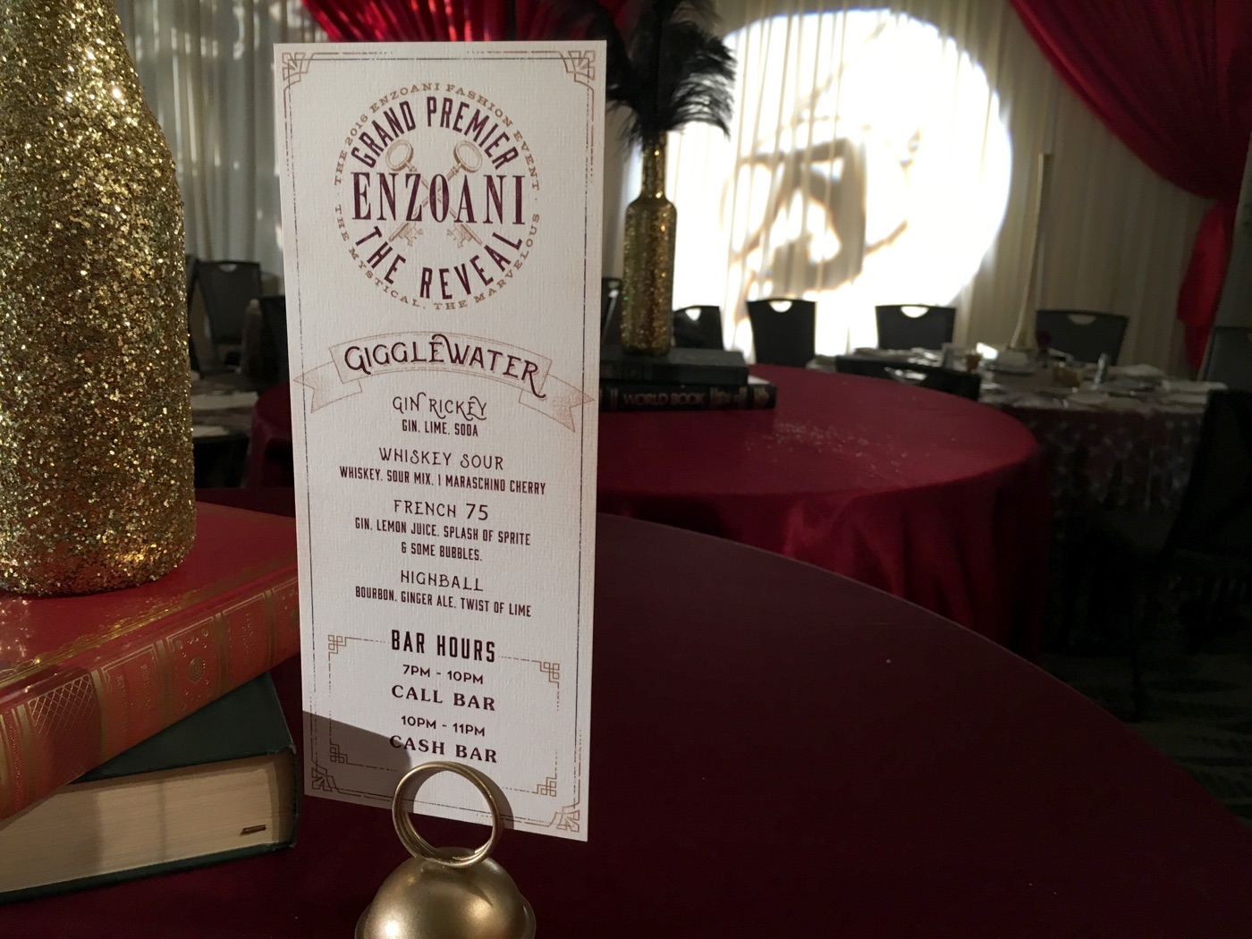 2016 Enzoani Grand Premier “Gigglewater” speakeasy bar menu on a red-draped table