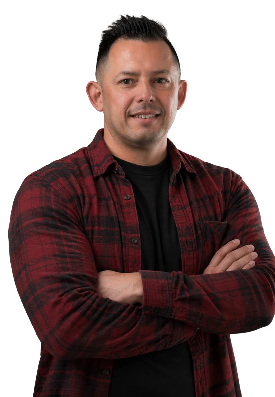 Steve Padilla in a red plaid flannel shirt, arms crossed
